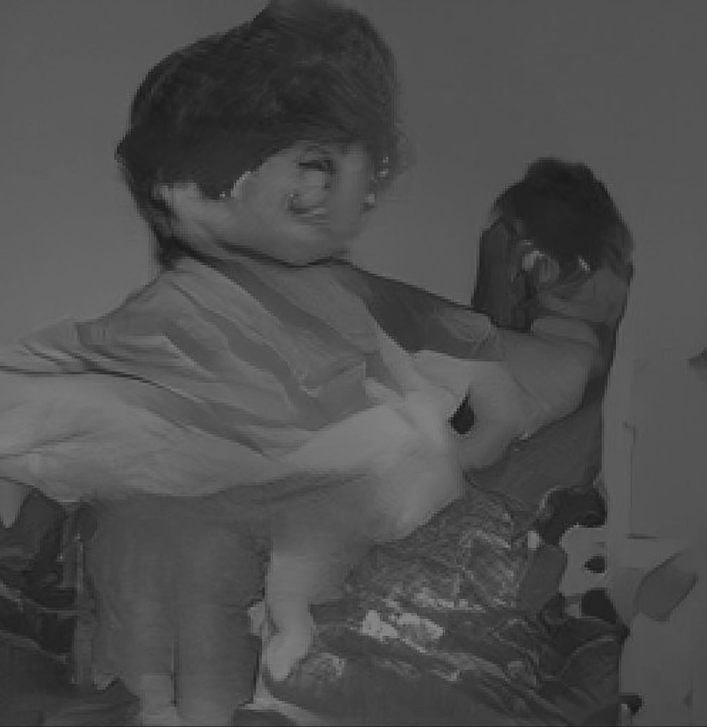 the same AI generated caption: A young girl is holding a teddy bear.