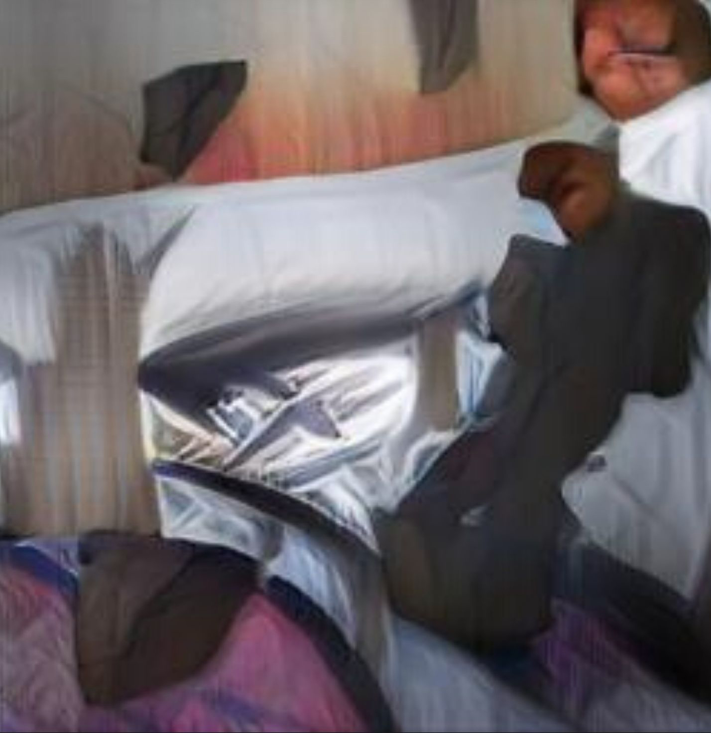An AI generated Artwork: A man laying on top of a bed under a blanket.