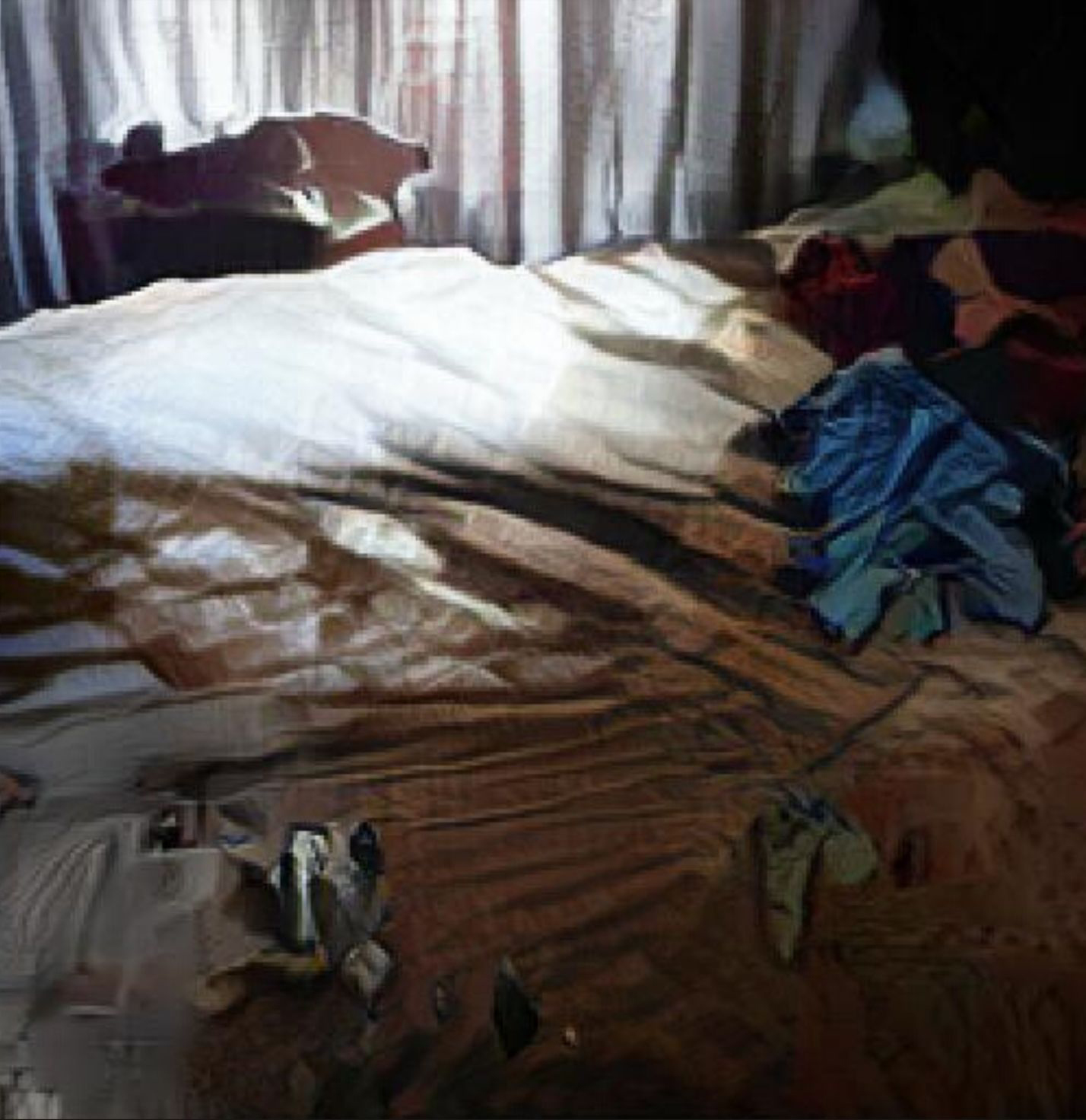 An AI generated Artwork: A man laying on top of a bed under a blanket.