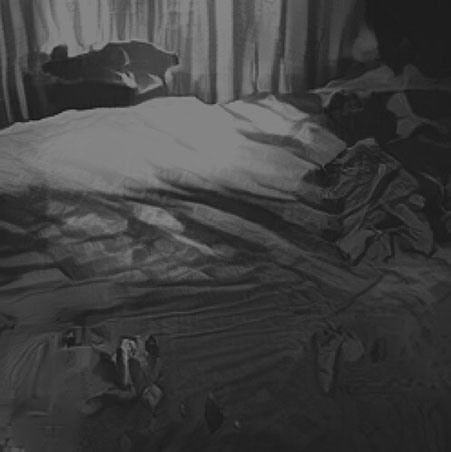 A new AI generated caption: A bed with a white comforter and pillows.