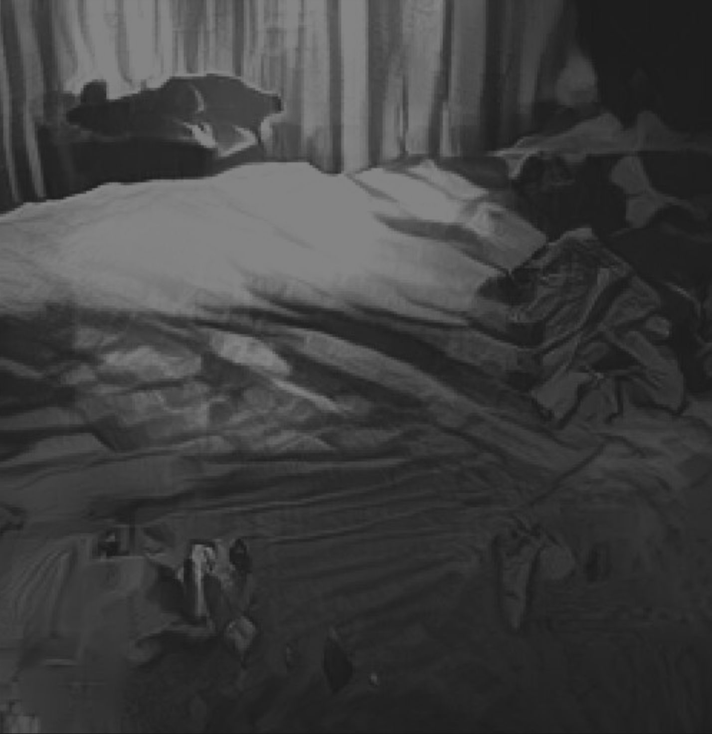 A new AI generated caption: A bed with a white comforter and pillows.