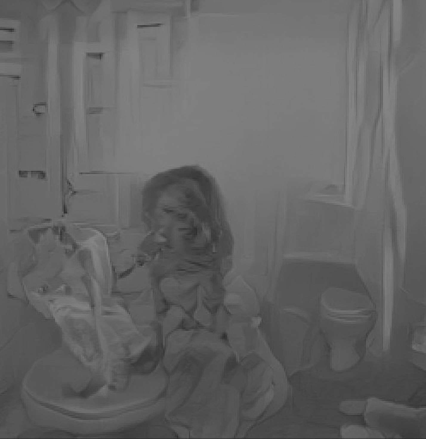 A new AI Generated caption: A little girl sitting on a toilet in a bathroom. 